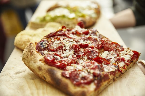 Pizza por porción en Roma
